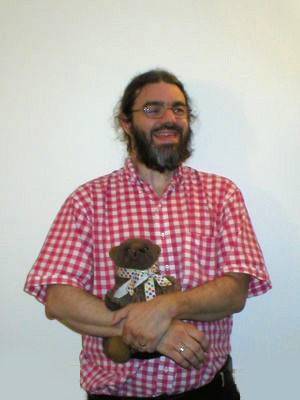 Bob holding a teddy bear named Meep